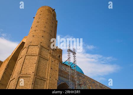 View of the scaffolding crane, part of a renovation, preservation project on the roof. At the Timirud style, Silk Road era iconic site, the Khoja Ahme Stock Photo