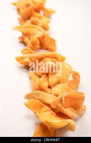 Dried melon slices isolated on a white background. Dried fruit. Stock Photo