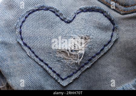 heart shaped patch on jeans fabric Stock Photo