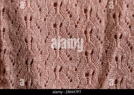 salmon pink knitted jumper pattern close up Stock Photo