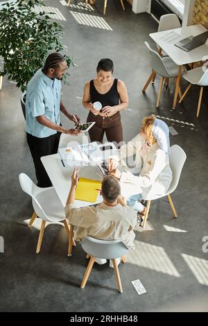 happy multiethnic colleagues working on startup ideas in coworking, gadgets, open space, digital Stock Photo