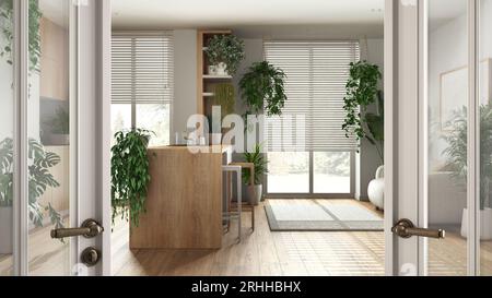 Classic white glass door opening on wooden kitchen and living room with sofa and many houseplants. Welcome home concept, urban jungle interior design Stock Photo