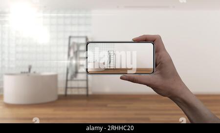 Hand holding smart phone, AR application, simulate furniture and interior design products in real home, architect designer concept, blur background, m Stock Photo