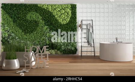 Wooden table, desk or shelf with potted grass plant, house keys and 3D letters home sweet home, over bathroom with vertical garden, architecture inter Stock Photo