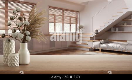 Wooden table, desk or shelf close up with ceramic vases with cotton flowers over minimal japandi kitchen and living room, minimalist style interior de Stock Photo
