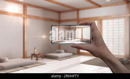Hand holding smart phone, AR application, simulate furniture and interior design products in real home, architect designer concept, blur background, m Stock Photo