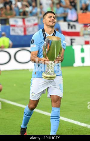 Piraeus, Lombardy, Greece. 17th Aug, 2023. 16 RODRIGO of Manchester City with the trophy after winning the UEFA Super Cup match between Manchester City and Sevilla FC at Georgios Karaiskakis Stadium on August 16, 2023, in Piraeus, Greece. (Credit Image: © Stefanos Kyriazis/ZUMA Press Wire) EDITORIAL USAGE ONLY! Not for Commercial USAGE! Stock Photo