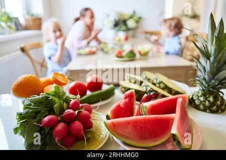 Variety of fresh fruits and vegetables on table at home Stock Photo