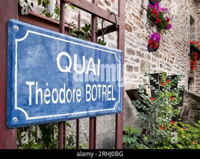 PONT AVEN French Rustic blue road sign ‘QUAI Theodore Botrel’ Pont Aven Brittany France. Floral quaint rustic typical Bretagne scene Brittany France Stock Photo