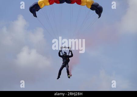 Farnborough, Hants, UK. 17th Aug, 2023. Scenes on the first day of the British Motor Show on Farnborough International Airport OPS: The Lightning Bolts, the ArmyÕs parachute display team fall out of the sky over the Cinch display arena. Credit: Motofoto/Alamy Live News Stock Photo