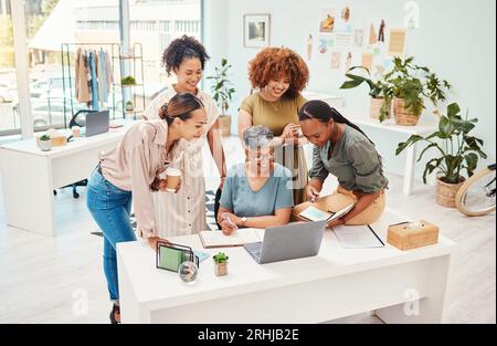 Business women, fashion designer and laptop with teamwork, planning or brainstorming in office of website launch. Professional creative people in Stock Photo