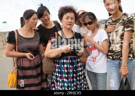 Chinese citizens tour the Khorgos Special Economic Zone on the China-Kazakhstan border. Stock Photo