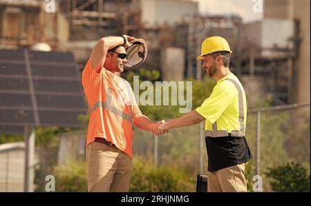 image of construction supervisor handshaking deal. construction supervisor handshaking deal. Stock Photo