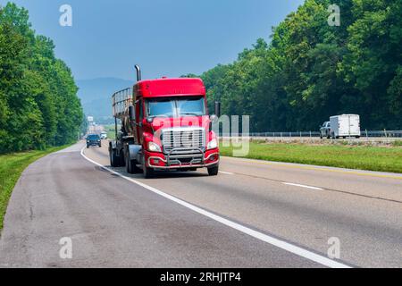 Horizontal shot of a red fuel delivery truck on an interstate highway. Stock Photo