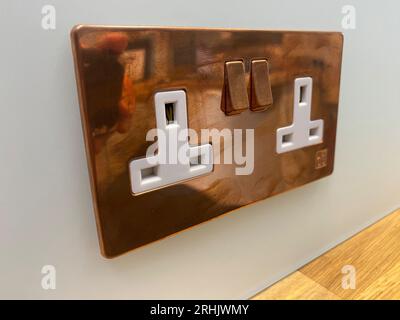 Bronze coloured double plug socket Stock Photo