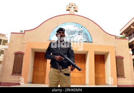 Hyderabad, Pakistan, August 17, 2023. Police officials are standing high alert to avoid untoward incident as security has been tightened after attack on churches in Jaranwala, outside Church in Hyderabad on Thursday, August 17, 2023. Stock Photo