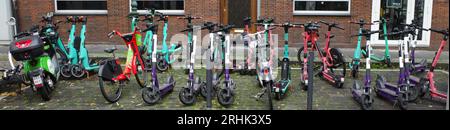 Düsseldorf, Germany - Aug 2 2023 Rental e-scooters are parked chaotically. They are from Tier, Check and Voi. Stock Photo