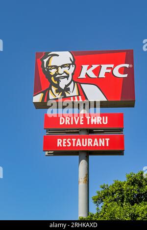 Mdina, Malta -4 August 2023: Large sign for a drive thru restaurant operated by the Kentucky Fried Chicken KFC isolated against a deep blue sky Stock Photo