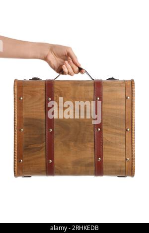 Female hand holding retro wooden suitcase on white background Stock Photo