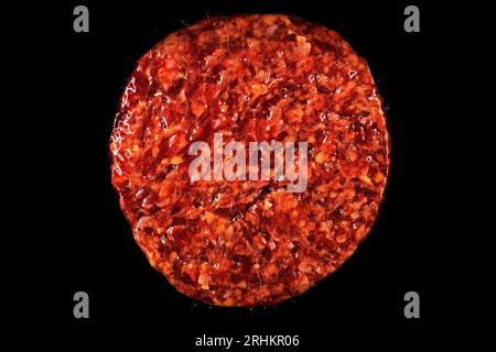 beef raw hamburger patty in package on black background Stock Photo