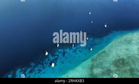 Aerial views on our sailing catamaran at the stunning Bora Bora Atoll; French Polynesia Stock Photo