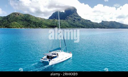 Aerial views on our sailing catamaran at the stunning Bora Bora Atoll; French Polynesia Stock Photo