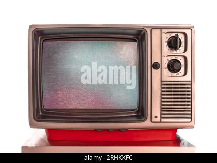 Plastic made grandma's vintage cathode ray analog television monitor used for TV broadcasts, films, and video games with random pixel pattern on the s Stock Photo