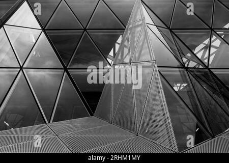 Black and white tone, Exterior view of mixture various  triangular pattern of aluminium cladding facade. Stock Photo