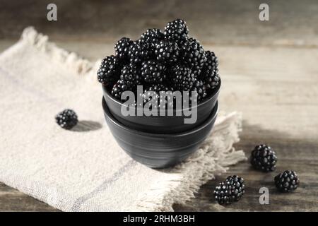 Fresh ripe blackberries on rustic wooden table, closeup Stock Photo