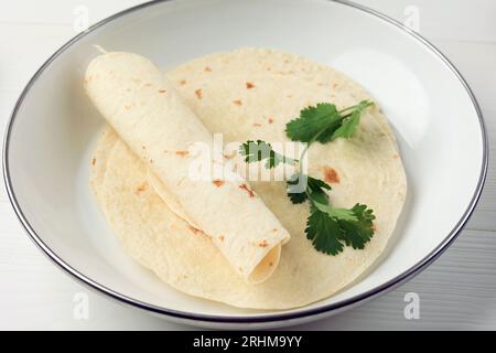Plain Wheat Tortilla Wrap on White Background, Close Up Stock Photo