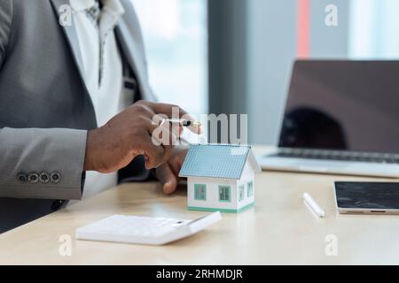 Real estate agent talked about the terms of the home purchase agreement Stock Photo