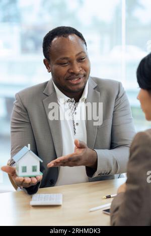 Real estate agent talked about the terms of the home purchase agreement Stock Photo
