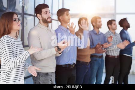 Image of successful business clapping in the office Stock Photo