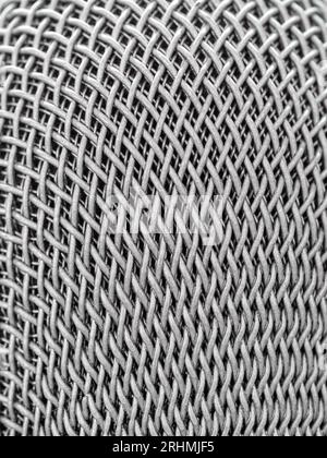 Steel grille background. Close-up shot of microphone , Selective focus Stock Photo