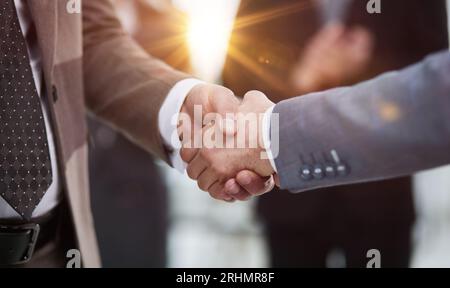 Nice to meet you. Close-up of two young businessmen shaking hands Stock Photo
