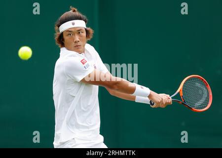 Tennis player Zhizhen Zhang of China in action at the 2023 Wimbledon Championships ,All England Lawn Tennis and Croquet Club,London,England. Stock Photo