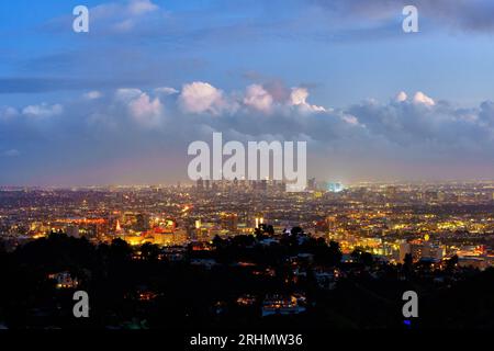 Mesmerizing nighttime panorama of Los Angeles, awash in twinkling lights, as seen from the elevated vantage point of Runyon Canyon's overlook. Stock Photo