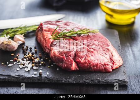 Raw fillet steak beef meat on the cutting board. Stock Photo