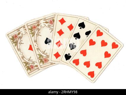 A poker hand of antique playing cards featuring a full house of tens and aces on a white background. Stock Photo