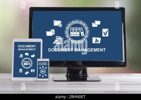 Document management concept shown on different information technology devices Stock Photo