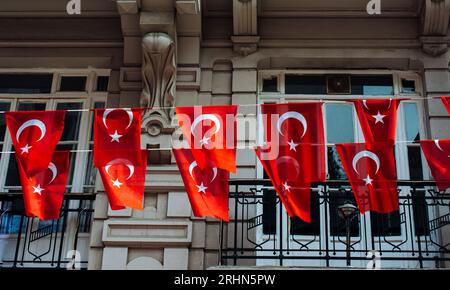 Turkish national flags with white star and moon in sky Stock Photo