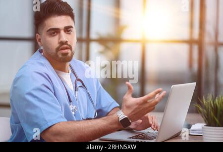 Serious professional general practitioner looking at the camera Stock Photo