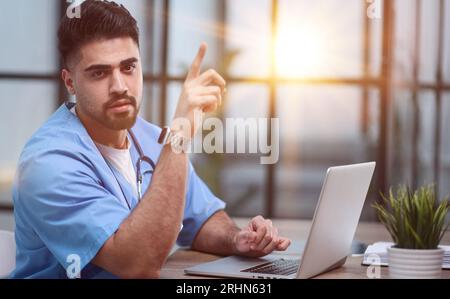 Serious professional general practitioner looking at the camera Stock Photo