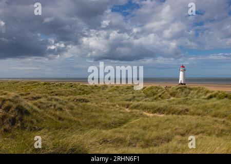 Lighthouse on Talacre Beach at low tide with sand dunes North wa Stock Photo