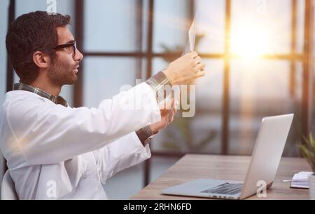 Neurosurgeon checking brain at mri scan before surgery. Stock Photo