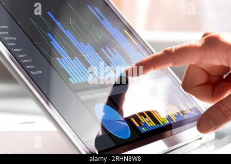 Financial Data Analyst Female Using KPI Dashboard On Laptop Stock Photo