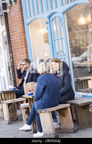 People enjoying coffee at a trendy café on Redchurch Street, Shoreditch, East London, a hub of hipster culture and creative industry Stock Photo