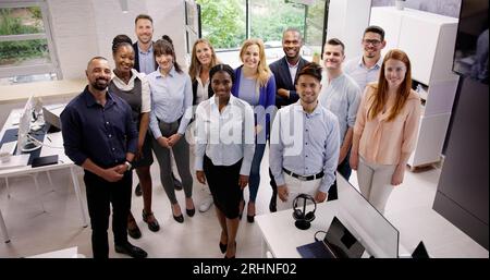 Happy Group Of Business People Standing In Office Stock Photo