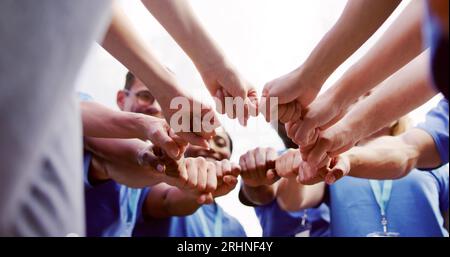 Volunteer Charity Team Joining Hands Together. Teamwork Concept Stock Photo