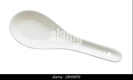top view of white ceramic soup spoon cutout on white background Stock Photo